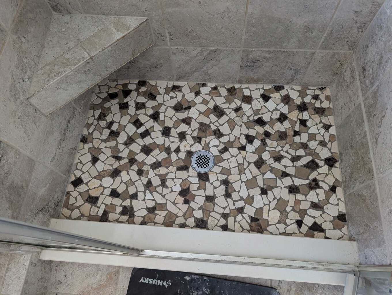 Primary shower pebbles enhanced