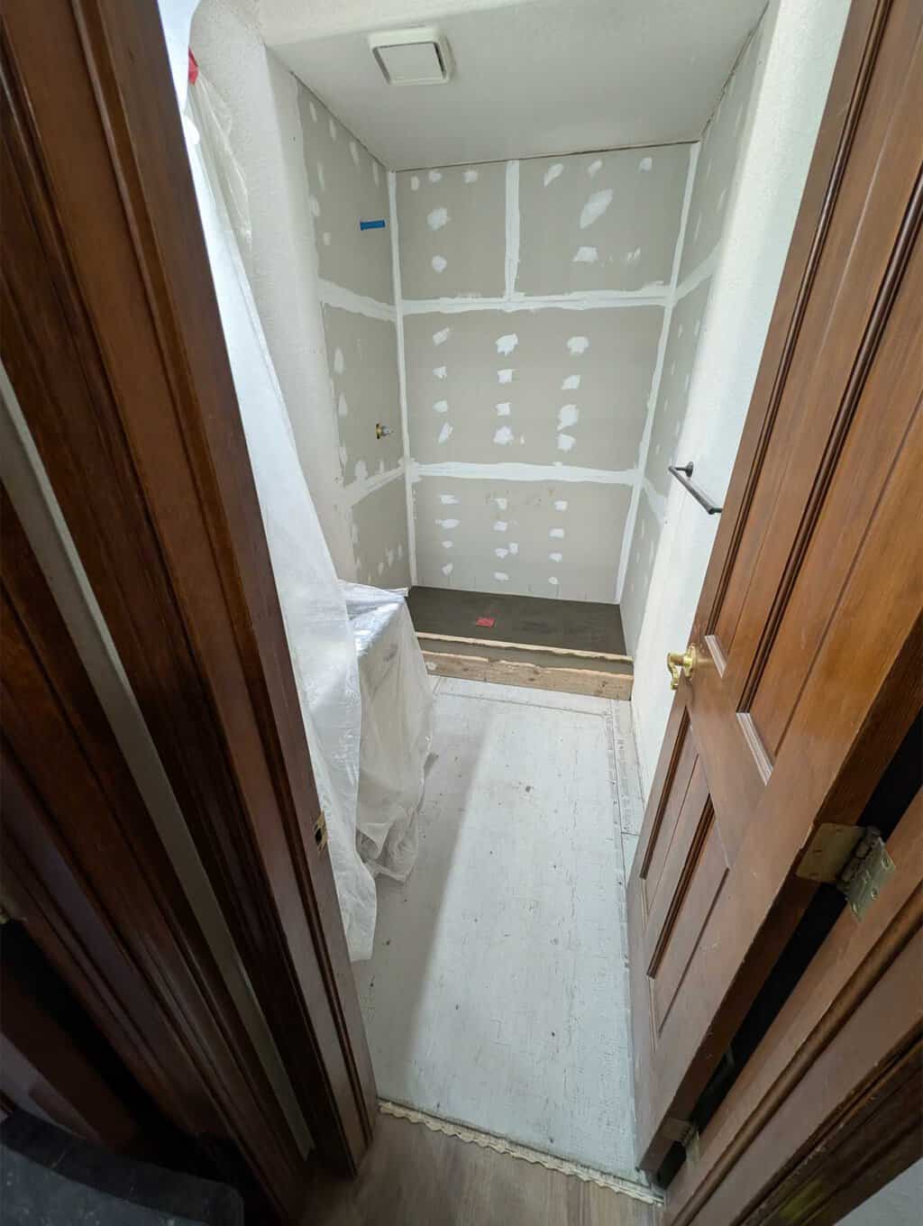 Guest shower and floor ready for tile