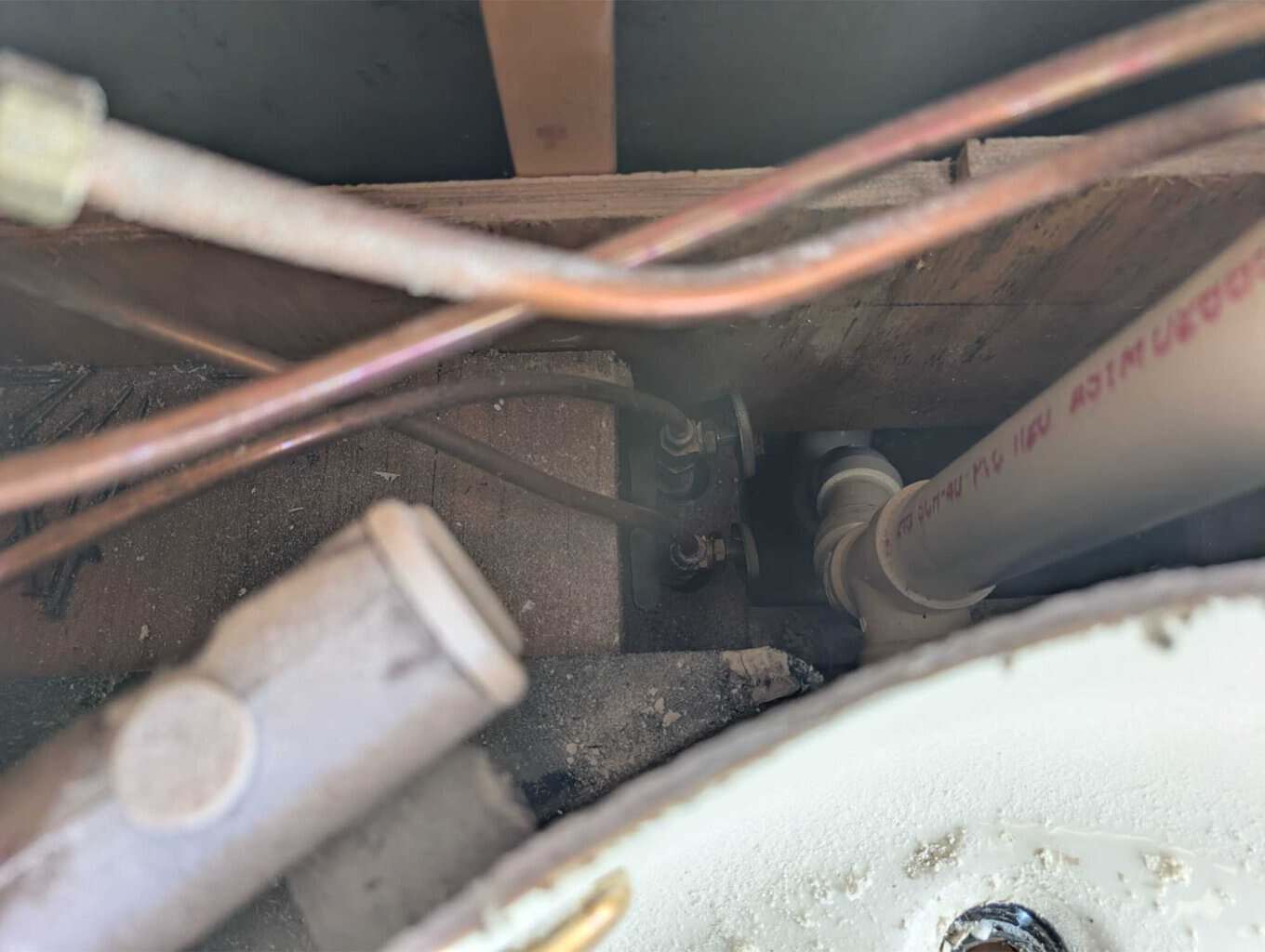 No access panel and supply lines completely down inside floor