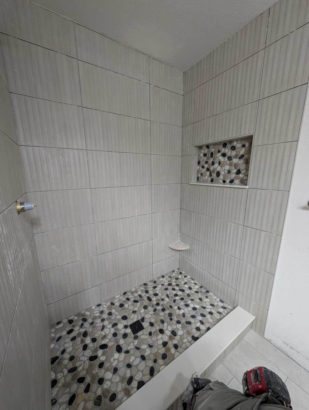 Niche and shower floor pebbles grouted