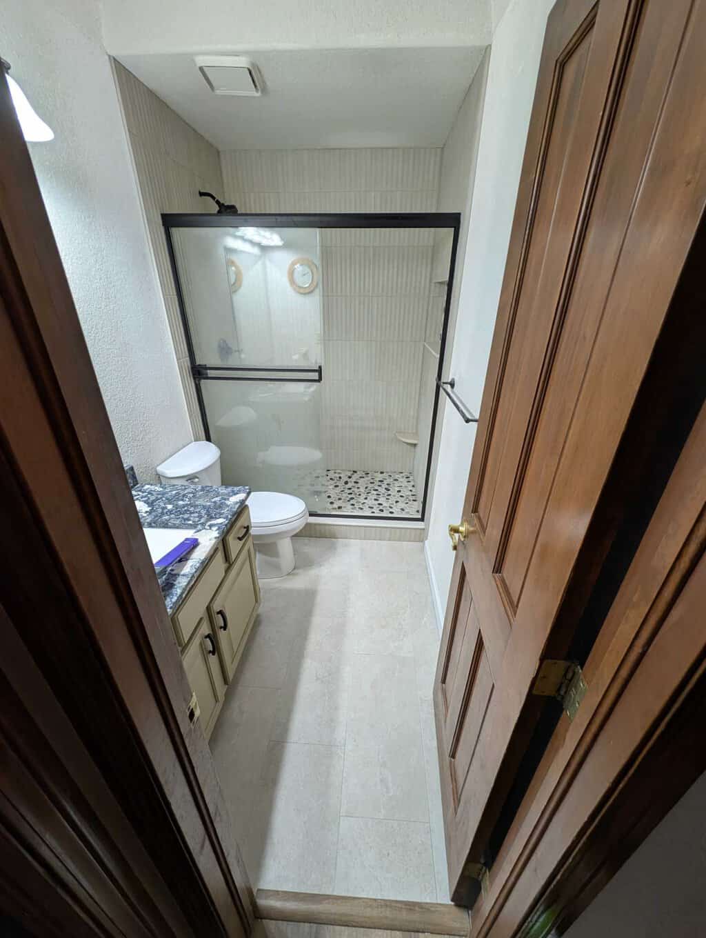 Guest bathroom floor and shower complete
