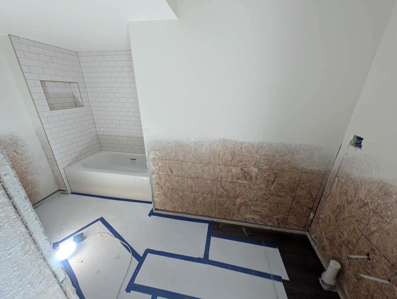 Basement tub surround grouted and finished