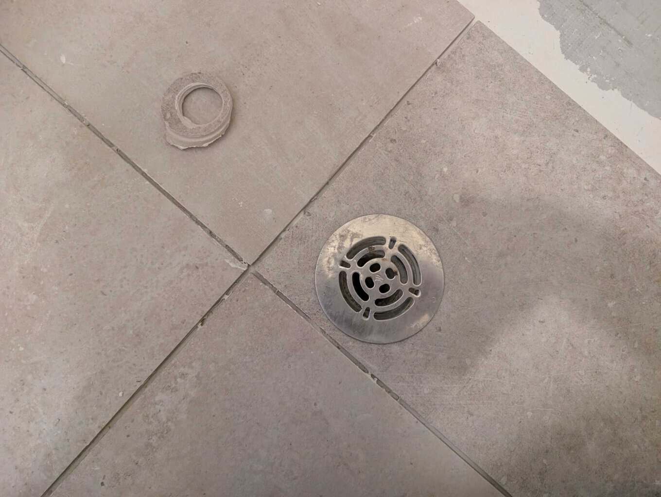 Laundry drain fits into tile