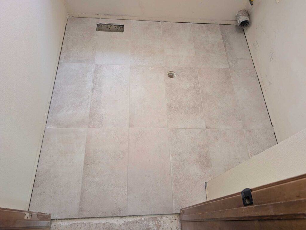 Laundry floor grouted and finished